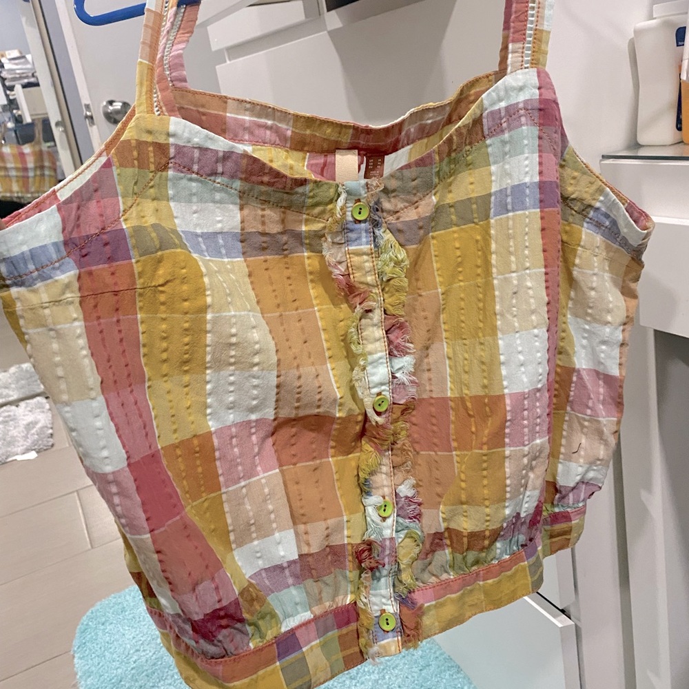 Cute top. Nice quality material.